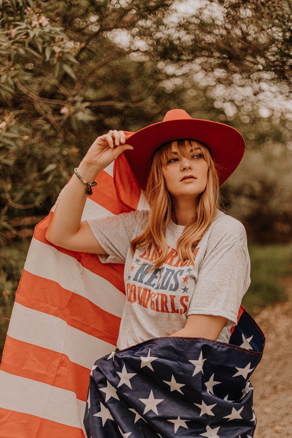 America Needs Cowgirls Graphic Tee