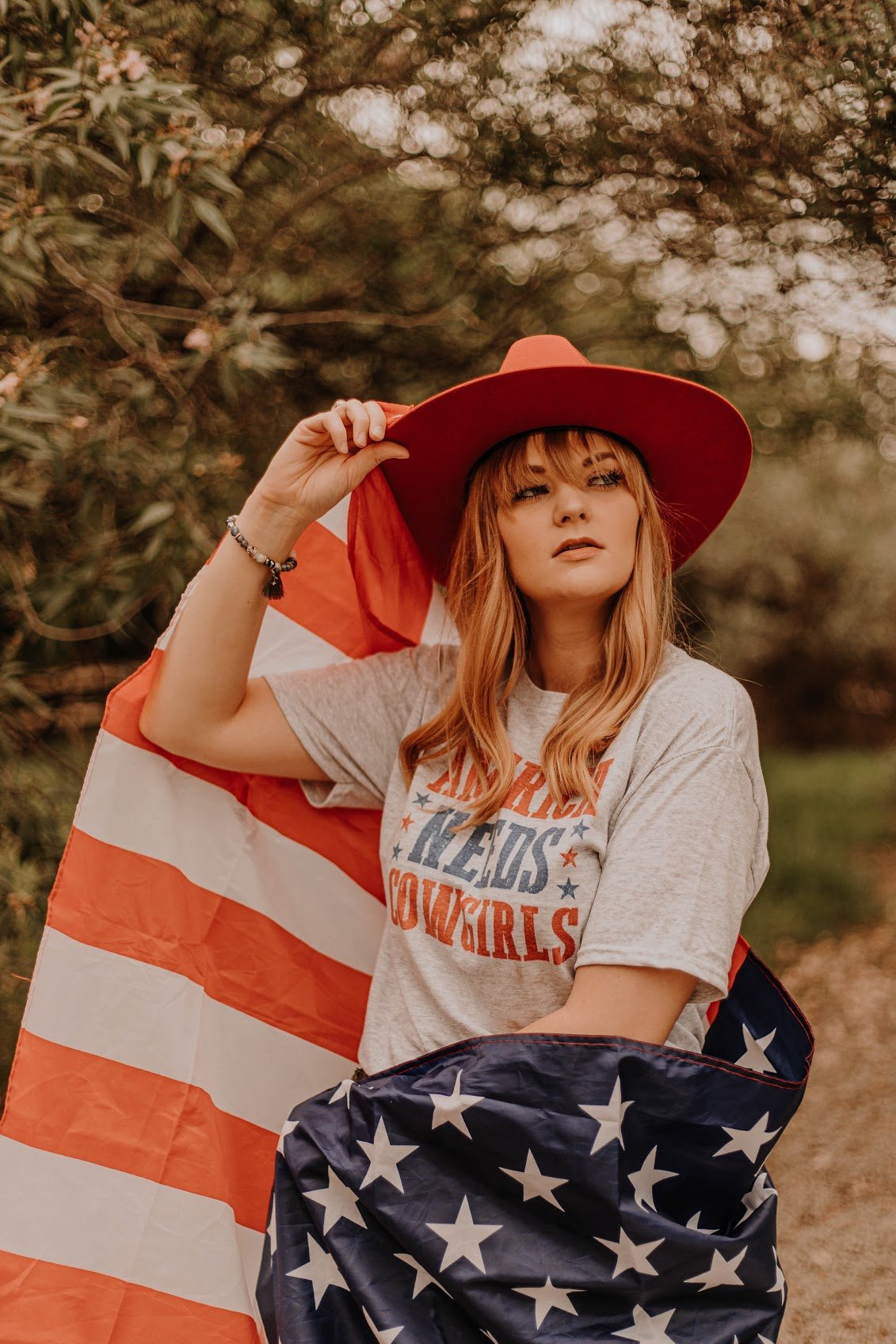 America Needs Cowgirls Graphic Tee